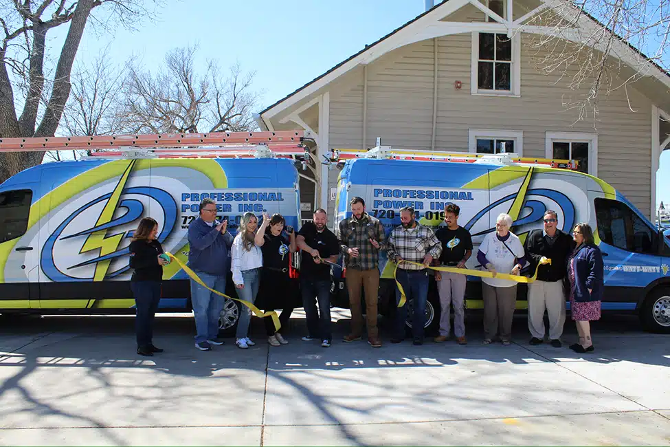 The Professional Power Team doing a ribbon cutting.